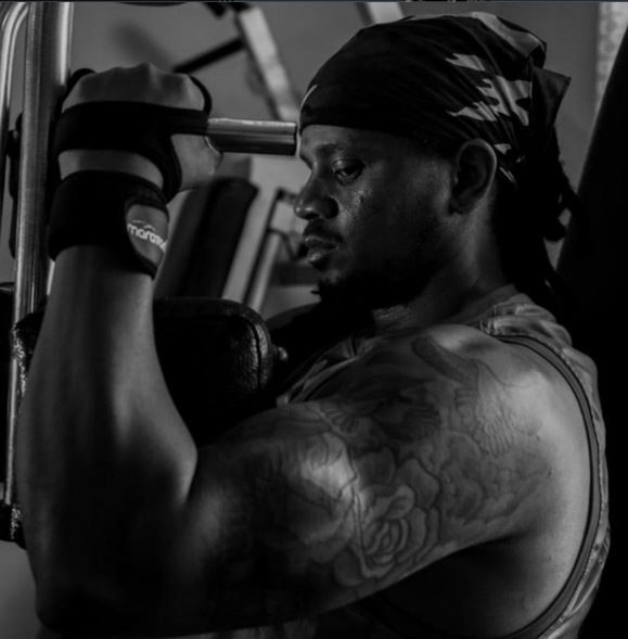Champion Gym member training with dumbbell